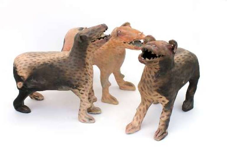 Tribe of three red patterned dogs with teeth - Morag MacInnes