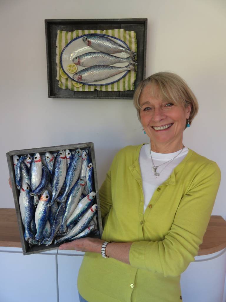 Diana with some examples of her fish ceramics! - Diana Tonnison