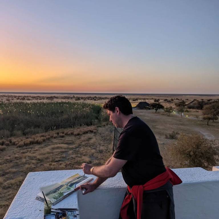 The Artist sketching from the old German Fort at  Manutoni Camp Etosha, Namibia - Neil Pittaway