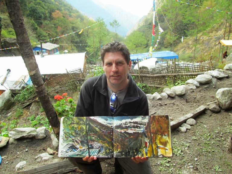 The Artist holding his sketchbook in Langtang National Park, Nepal Himalayas - Neil Pittaway