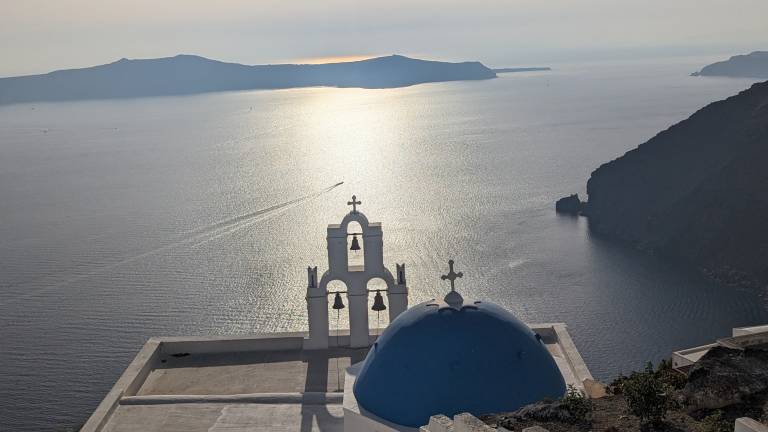 View from Thira of the church with three bells, Santorini, Greece - Neil Pittaway