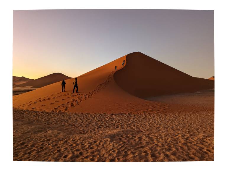 Starting to walk up Dune 45 at first sunlight, Namibia - Neil Pittaway
