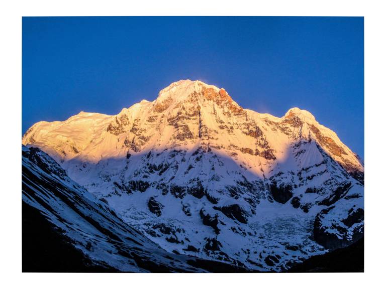 First light catching Annapurna South from Machapuchare Base Camp, Nepal - Neil Pittaway