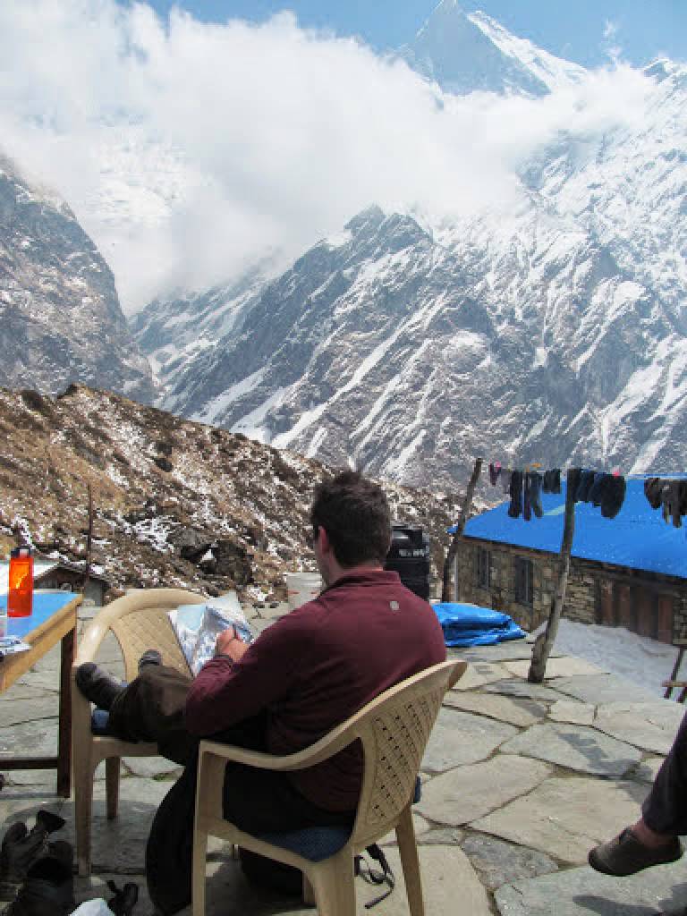 The Artist painting at Machapuchare Base Camp, Annapurna Sanctuary, Nepal - Neil Pittaway