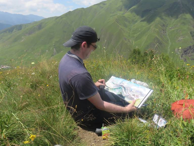 The Artist sketching above Ushguli, Georgia - Neil Pittaway