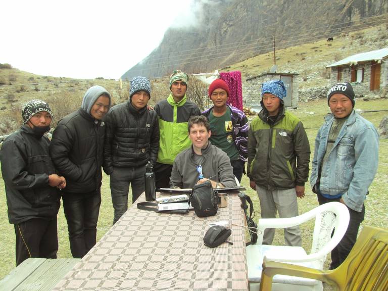 The Artist sketching and the Sherpa Crew in Old Langtang Village - Neil Pittaway