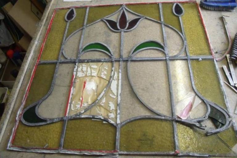 Badly damaged window from a front door - Caroline Channing