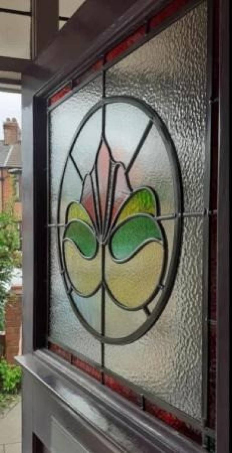 Repaired front door window set into a new surround - Caroline Channing