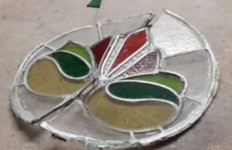 A badly damaged front door window - Caroline Channing